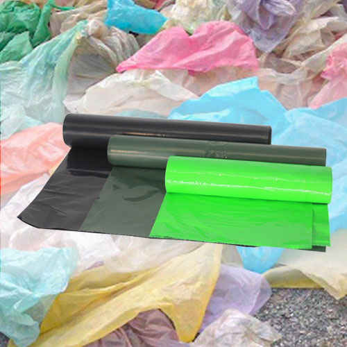 Green plastic bags made from plastic waste that have been used by the consumers (posted consumer recycled resin).