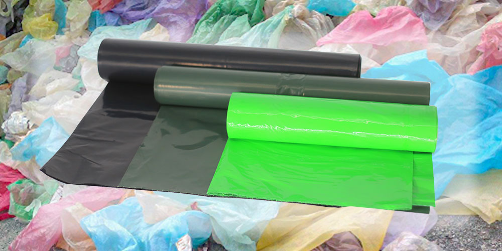 Green plastic bags made from plastic waste that have been used by the consumers (posted consumer recycled resin).